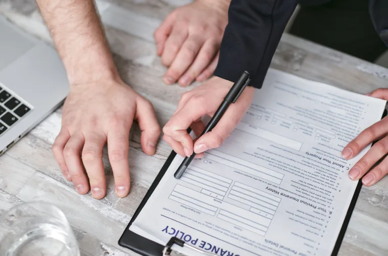 Illustration of a contractor reviewing insurance documents on a construction site