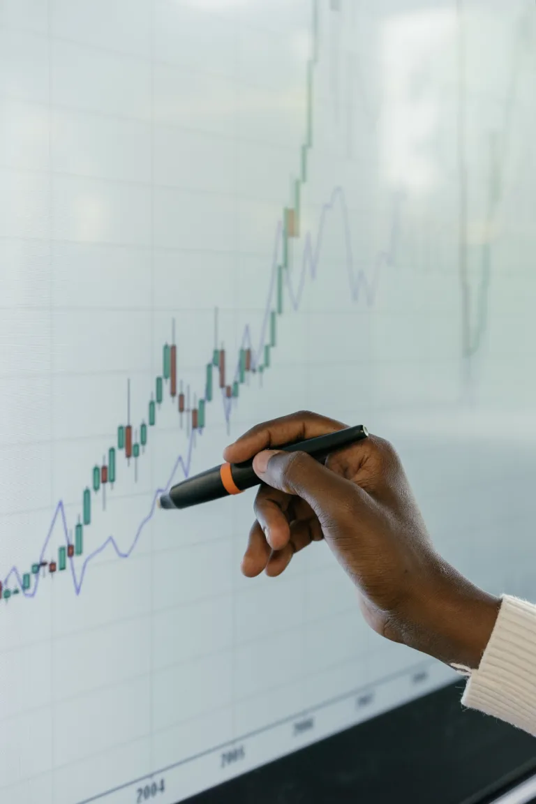 Sole trader bookkeeping records and HMRC registration documents on a desk
