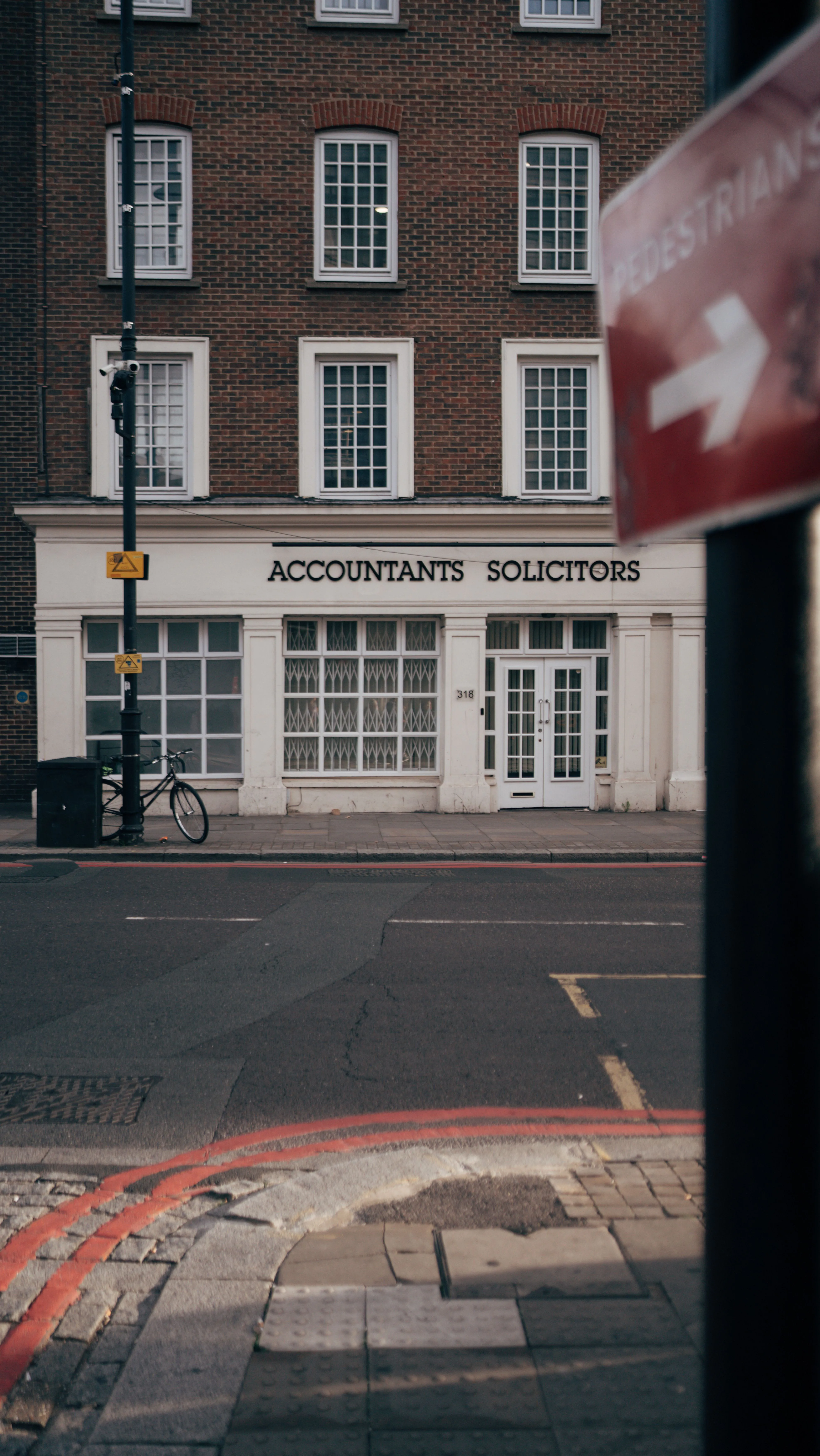 Solicitor reviewing SRA-compliant client account records with accountant in Slough