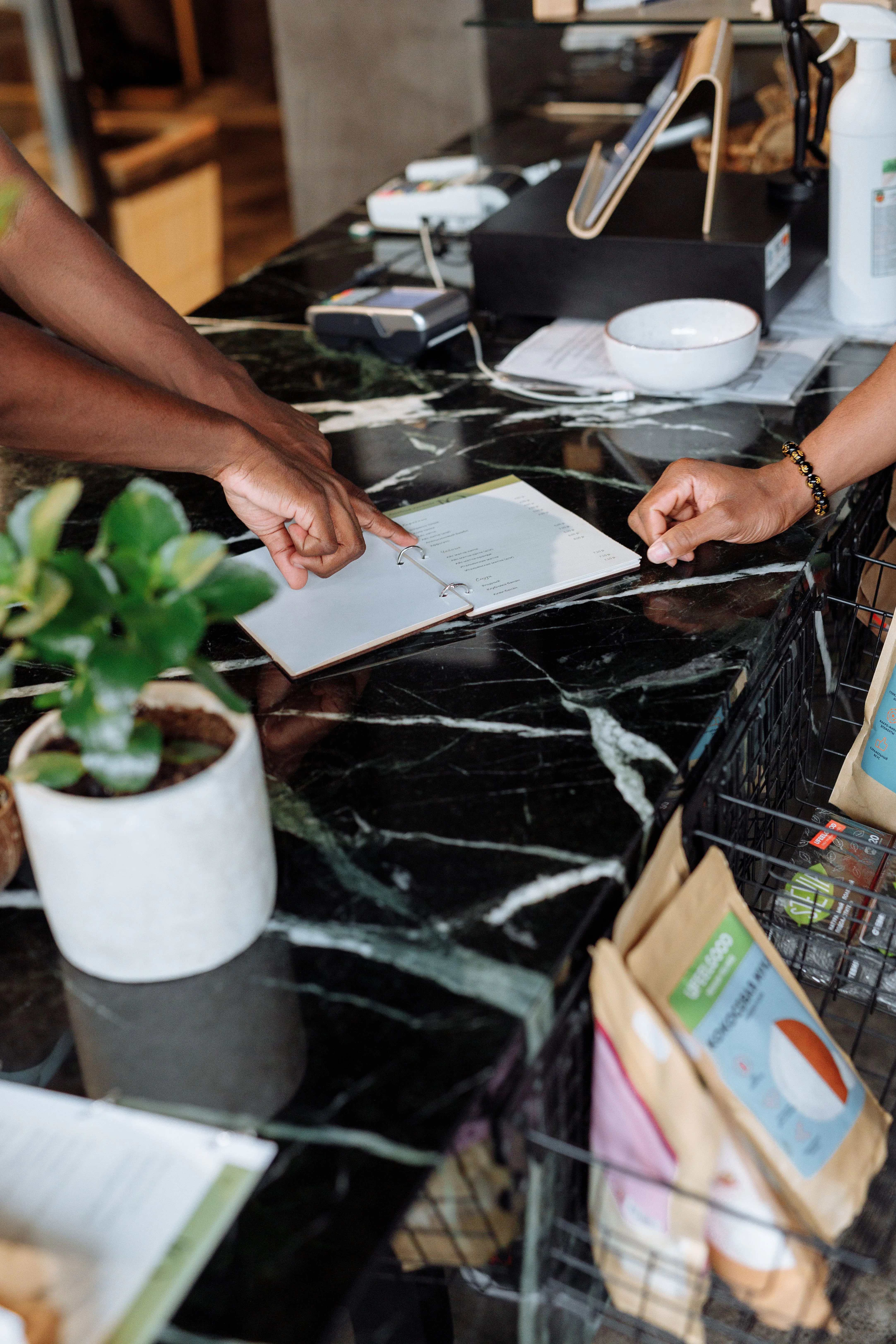 Business owner reviewing accounting documents with Direct Assist in Slough